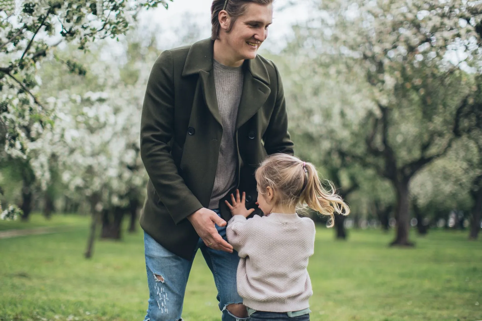 A landlord out in a spring orchard with his daughter instead of doing the books